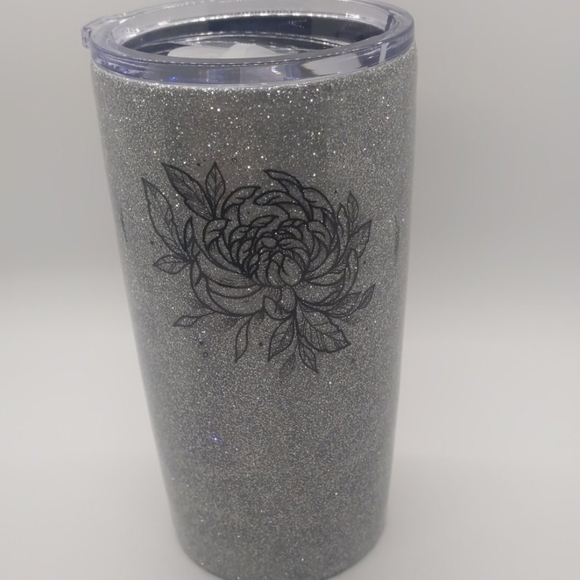 Glittery custom designed epoxied tumbler.
